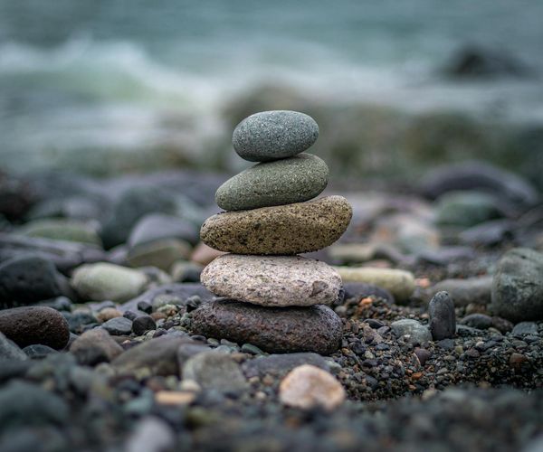 Smooth stones stacked on top of each other representing balance.